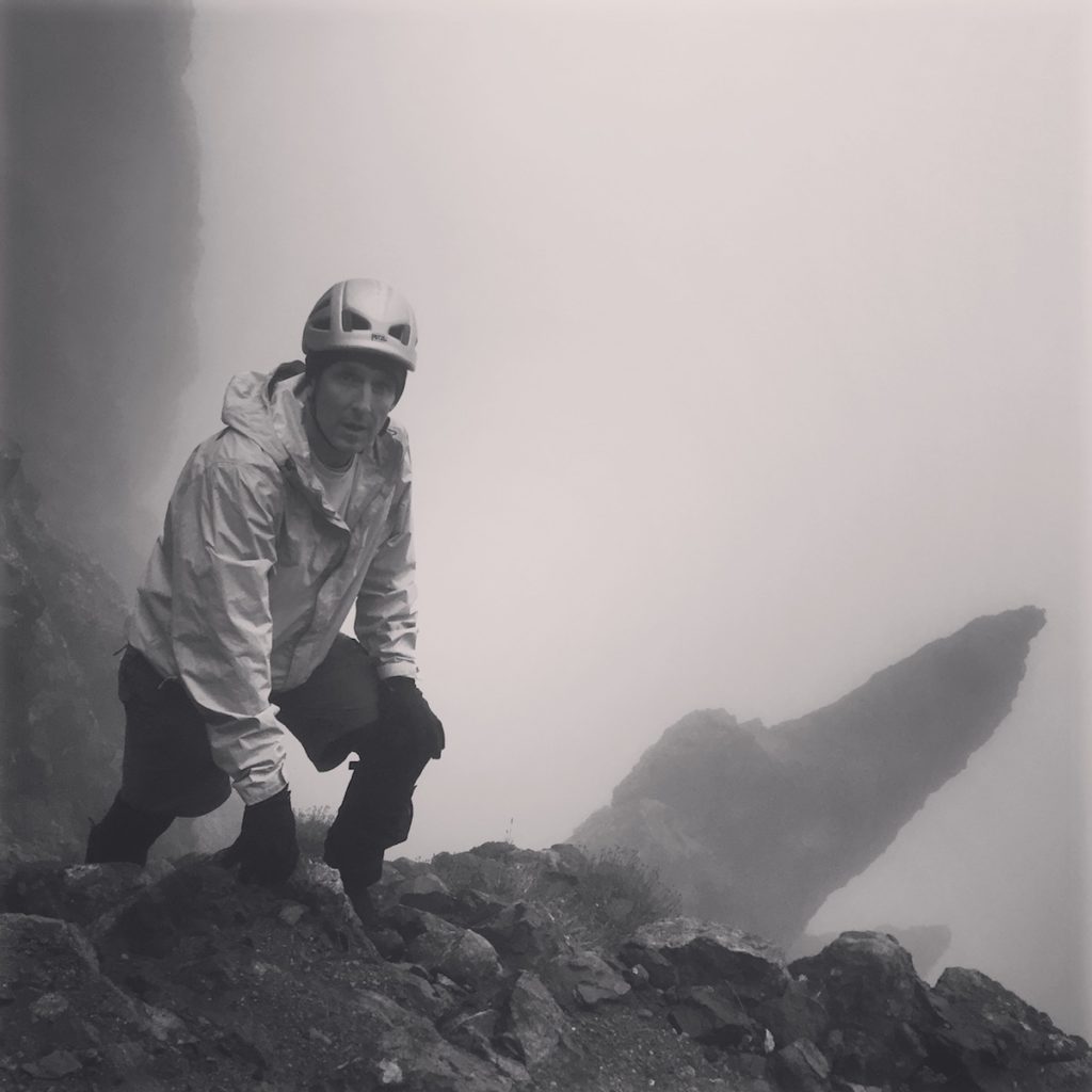 Ray Cameron on Crestone Peak ascending Broken Hand Pass in weather