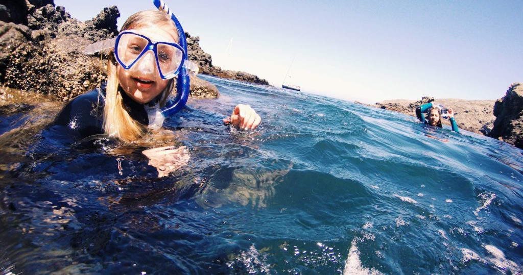 Gutsy girls snorkeling the sea caves of the channel islands